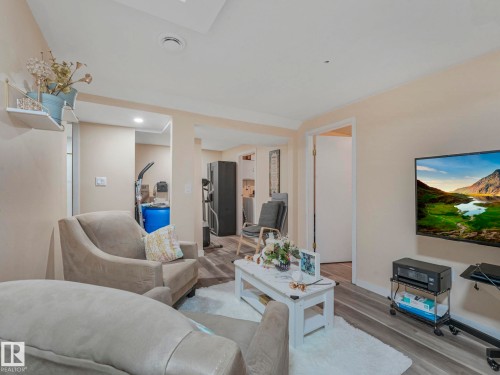Living room featuring wood finished floors and recessed lighting - 13271 47 Street, Edmonton, AB - Indoor Photo Showing Living Room