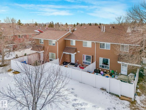 Snow covered property with a fenced backyard and a shingled roof - 13271 47 Street, Edmonton, AB - Outdoor