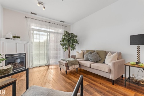 Edmonton, AB - Indoor Photo Showing Living Room With Fireplace