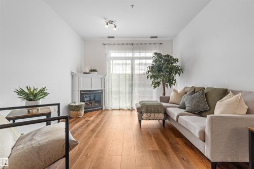 Edmonton, AB - Indoor Photo Showing Living Room With Fireplace