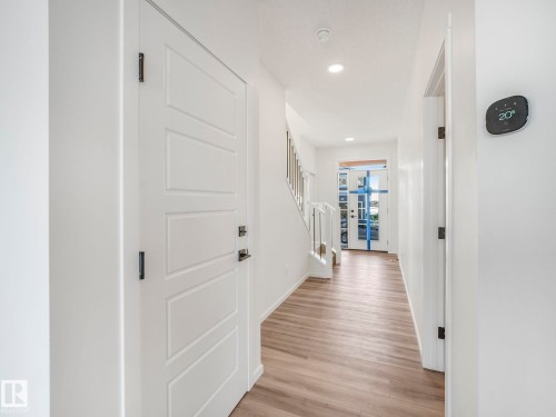 Corridor with light wood finished floors and recessed lighting - 20506 16A Avenue, Edmonton, AB - Indoor Photo Showing Other Room