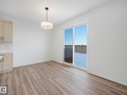 Unfurnished dining area with baseboards and light wood-style floors - 