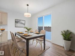 Dining area with dark wood finished floors - 