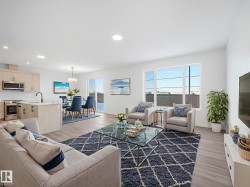 Living area featuring light wood-style floors and recessed lighting - 
