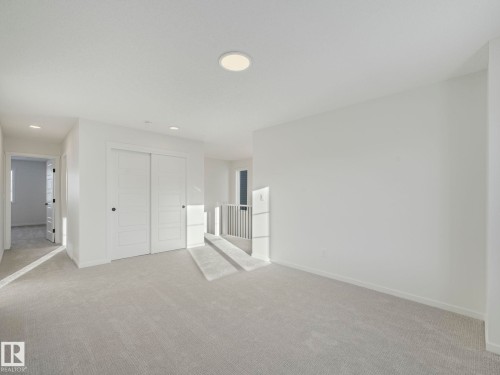 Unfurnished bedroom featuring a closet, carpet, and recessed lighting - 20506 16A Avenue, Edmonton, AB - Indoor Photo Showing Other Room