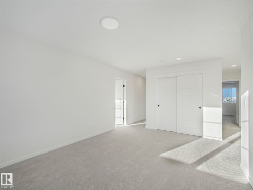 Unfurnished bedroom featuring carpet floors, a closet, and recessed lighting - 20506 16A Avenue, Edmonton, AB - Indoor Photo Showing Other Room