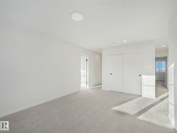 Unfurnished bedroom featuring carpet floors, a closet, and recessed lighting - 