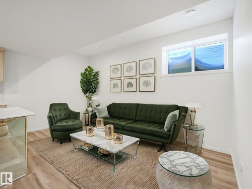 Living area featuring wood finished floors and recessed lighting - 20506 16A Avenue, Edmonton, AB - Indoor Photo Showing Living Room