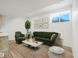 Living area featuring wood finished floors and recessed lighting - 