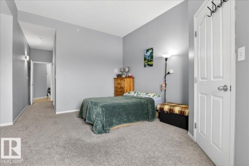 Bedroom featuring carpet floors and baseboards - 105 9707 105 Street, Edmonton, AB - Indoor Photo Showing Bedroom