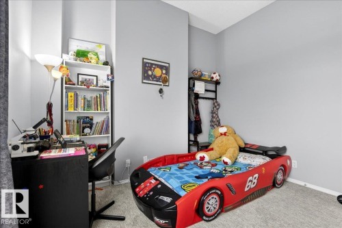 Carpeted bedroom with baseboards - 105 9707 105 Street, Edmonton, AB - Indoor