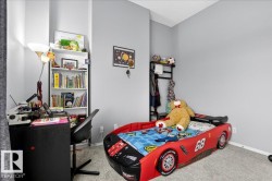 Carpeted bedroom with baseboards - 