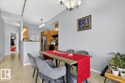 Dining room with baseboards and light tile patterned floors - 