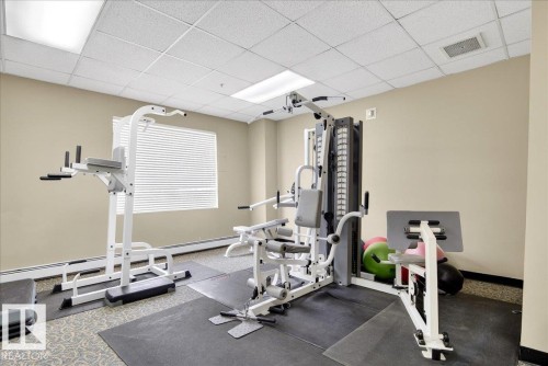 Exercise room with a paneled ceiling and a baseboard radiator - 105 9707 105 Street, Edmonton, AB - Indoor Photo Showing Gym Room