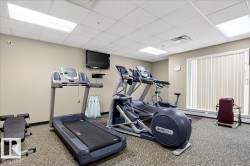 Workout area featuring a paneled ceiling - 