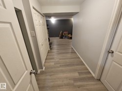 Hall with baseboards and light wood finished floors - 
