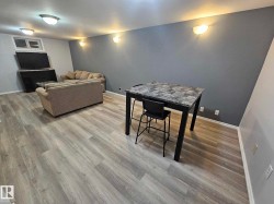 Dining room with light wood-style floors - 