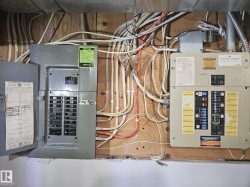 Utility room featuring electric panel - 