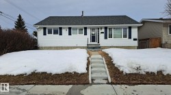 Ranch-style house featuring roof with shingles - 