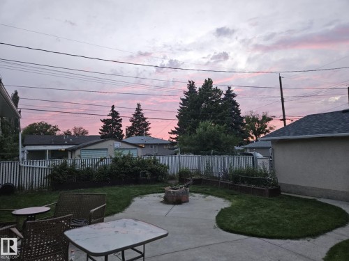 Fenced backyard with a patio and a fire pit - 8512 131 Avenue, Edmonton, AB - Outdoor