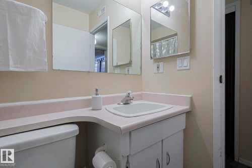 Bathroom featuring vanity and toilet - 1526 69 Street Nw, Edmonton, AB - Indoor Photo Showing Bathroom