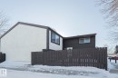 View of snow covered exterior with stucco siding - 1526 69 Street Nw, Edmonton, AB  - Outdoor With Exterior 