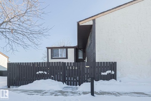 View of side of home featuring stucco siding - 1526 69 Street Nw, Edmonton, AB - Outdoor