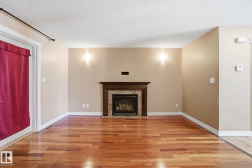 61 Suntree Promenade, Leduc, AB - Indoor Photo Showing Living Room With Fireplace
