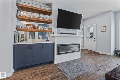 597 Meadowview Drive, Fort Saskatchewan, AB - Indoor Photo Showing Living Room With Fireplace