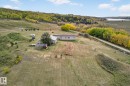 View of rural area featuring a nearby body of water and a heavily wooded area - 23509A Twp Road 484, Rural Leduc County, AB  - Outdoor With View 