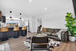Living area featuring recessed lighting and light wood-style flooring - 