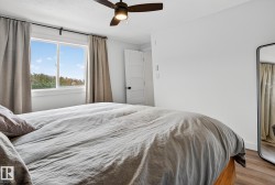Bedroom featuring wood finished floors and ceiling fan - 
