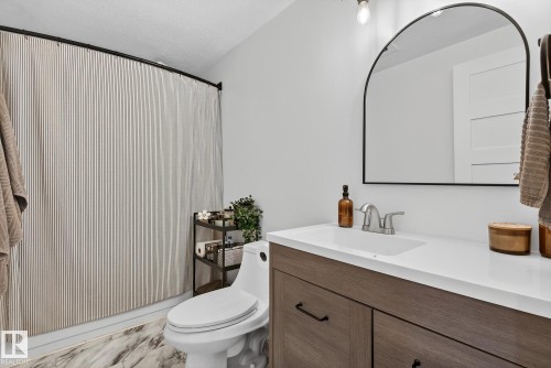 Bathroom featuring vanity and curtained shower - 23509A Twp Road 484, Rural Leduc County, AB - Indoor Photo Showing Bathroom