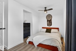 Bedroom featuring wood finished floors and ceiling fan - 