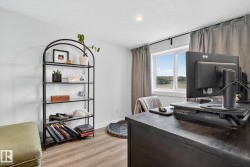 Office area with baseboards and light wood-style floors - 