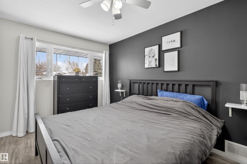 Bedroom featuring a ceiling fan and wood finished floors - 7719 71 Avenue, Edmonton, AB - Indoor Photo Showing Bedroom