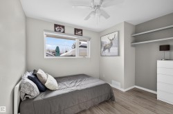 Bedroom with wood finished floors and ceiling fan - 