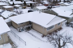Snowy aerial view featuring a residential view - 