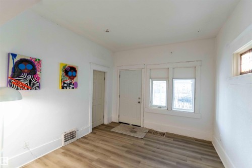 Entryway with healthy amount of natural light and wood finished floors - 11734 87 Street, Edmonton, AB - Indoor Photo Showing Other Room