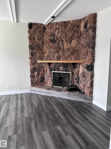 7604 7606 75 Street, Edmonton, AB - Indoor Photo Showing Living Room With Fireplace