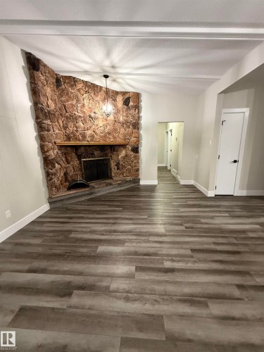 7604 7606 75 Street, Edmonton, AB - Indoor Photo Showing Other Room With Fireplace