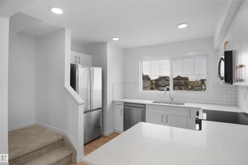 25 531 Merlin Landing Landing, Edmonton, AB - Indoor Photo Showing Kitchen With Double Sink With Upgraded Kitchen