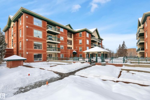 Snow covered property featuring a view of apartment building / complex - 203 35 Sir Winston Churchill Avenue, St. Albert, AB - Outdoor