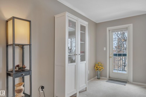 Doorway to outside featuring carpet floors and baseboards - 203 35 Sir Winston Churchill Avenue, St. Albert, AB - Indoor Photo Showing Other Room