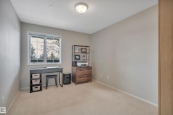 Office area featuring carpet floors and baseboards - 