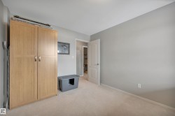 Unfurnished bedroom featuring a closet and light carpet - 