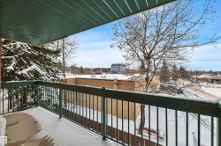 View of snow covered back of property - 