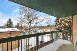 View of snow covered back of property - 