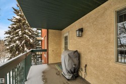 Snow covered back of property with grilling area - 