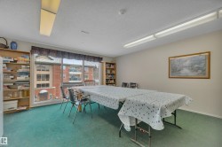 Carpeted dining space featuring a textured ceiling - 